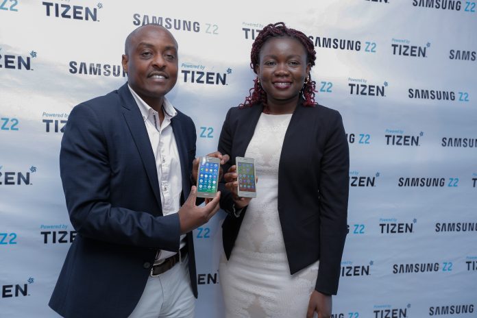 Samsung Business Leader IT & Mobile Division, Simon Kariithi together with the Product Manager, Idda Rasanga display the new Samsung Z2