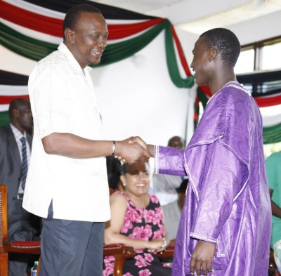 President Uhuru Kenyatta with David Owira. 