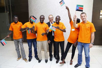 Honey Care Africa winners of the 2014 Nestle CSV Prize pose for a photo with Nestle Equatorial Africa CEO Cornel Krummenacher