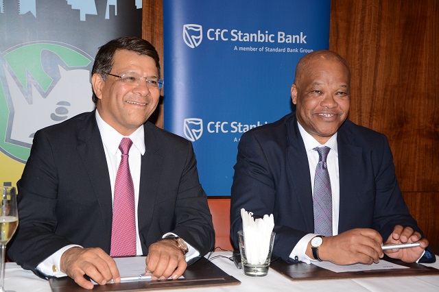ARM Cement's MD, Pradeep H. Paurana (left) and CfC Stanbic Bank's Director of Investment Banking East Africa, John Ngumi