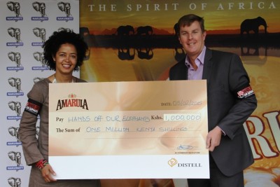 Dr.-Paula-Kahumbu-CEO-Wildlife-Direct-receives-donation-from-Mr.-Richard-Lord-GM-Distell-North-East-Africa-in-support-of-Hands-Off-Our-Elephants-Campaign-on-behalf-of-Amarula.jpg