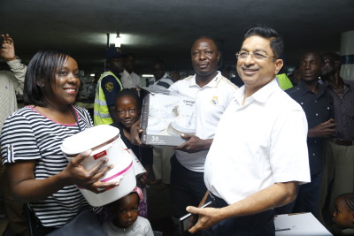 Nakumatt Holdings Operations Director Thiagarajan Ramamurthy shares a light moment with a section of the shoppers during the MEGA SALE