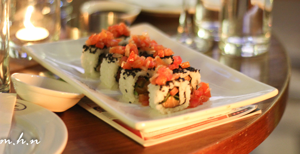 Salmon Tomato Roll A California roll-style sushi with rice, fresh salmon, onion & tomato 