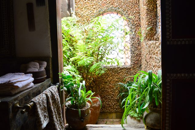 An open plan shower at one corner of the house 