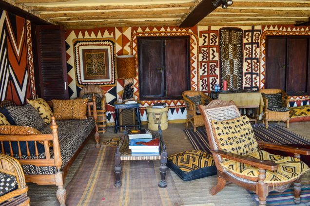 Fabrics with bold patterns from West Africa on the walls 